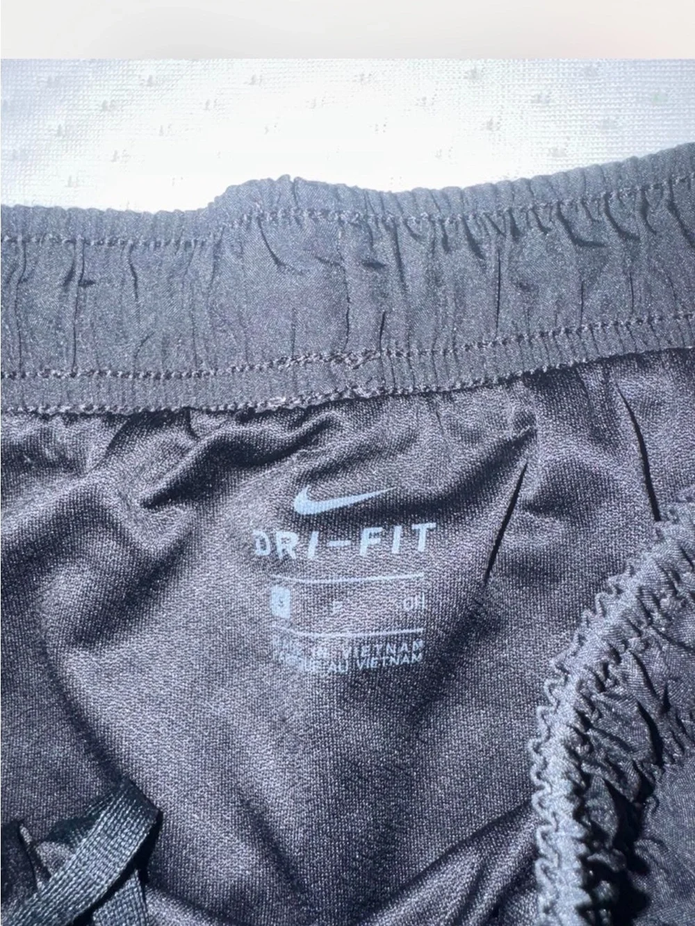 Nike Black Athletic Shorts with Red Trim and White Swoosh